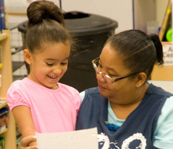 Teacher and student in early education classroom