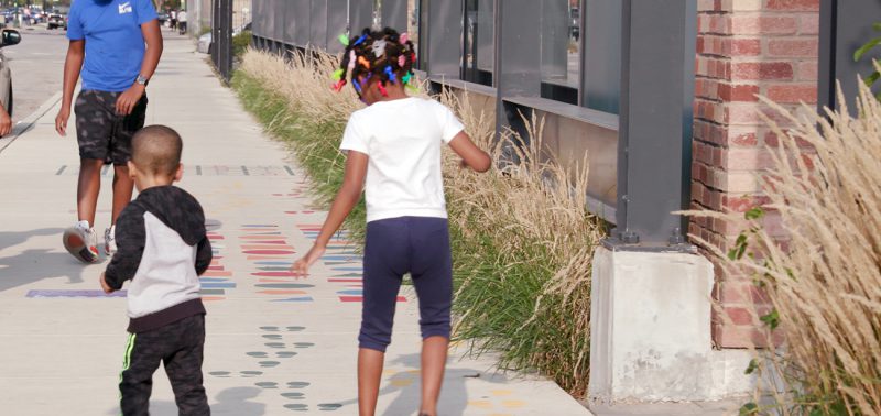 children interacting with Playful Learning early math installation