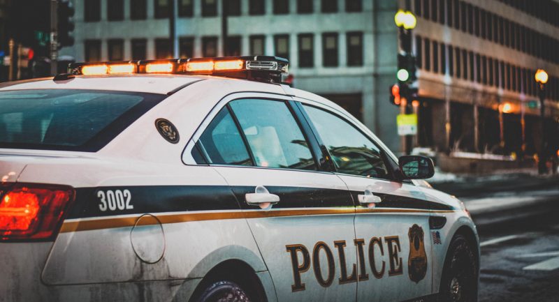 Police car parked on a city street