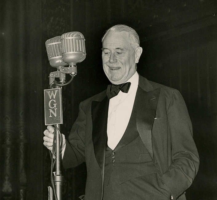 Robert R. McCormick speaking at a microphone